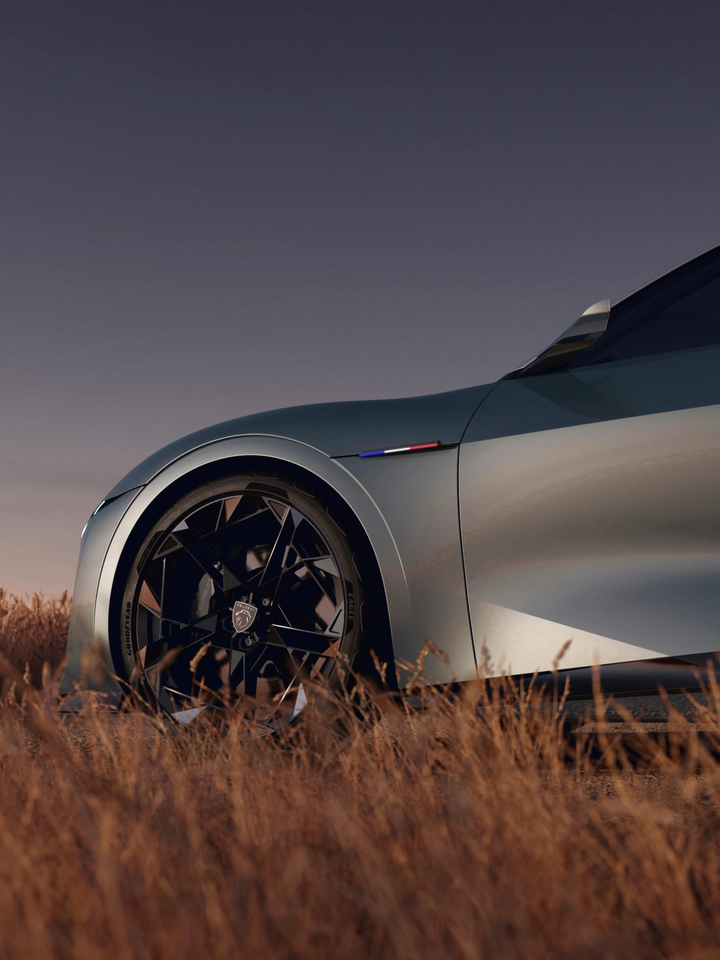 PEUGEOT RCZ Vision Concept, detal bocznej części nadwozia eksponujący przednie koło, emblemat i wyraziste przetłoczenia