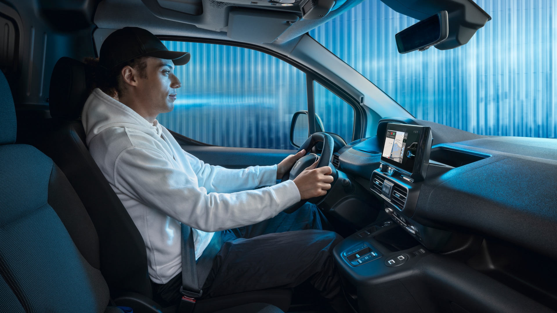 Man driving a PEUGEOT Partner