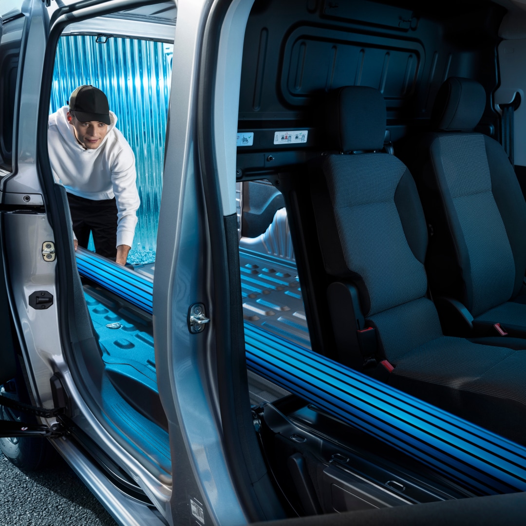 Man loading cargo into a PEUGEOT Partner