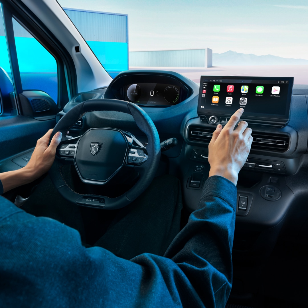 PEUGEOT Partner cockpit with a driver at the wheel
